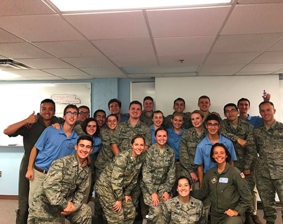 Arnold Air Society members pose together in the AFROTC classroom. 